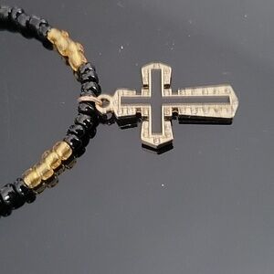 Handcrafted Black and gold beaded necklace with goldtone cross pendant